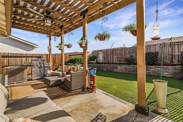 view of patio with area for grilling, a pergola, and ceiling fan