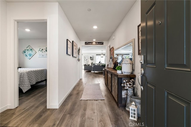 hall with dark hardwood / wood-style floors