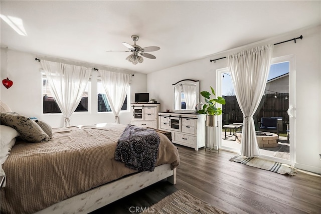 bedroom with ceiling fan, access to outside, and dark hardwood / wood-style flooring