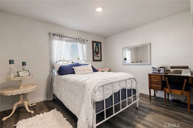 bedroom featuring dark wood-type flooring