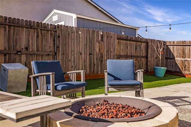 view of patio / terrace featuring an outdoor fire pit