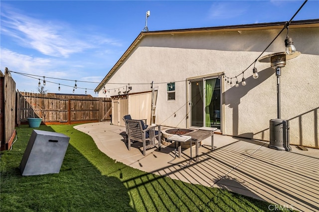 back of house featuring a yard and a patio