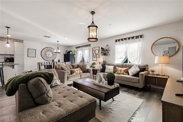 living room featuring dark hardwood / wood-style flooring