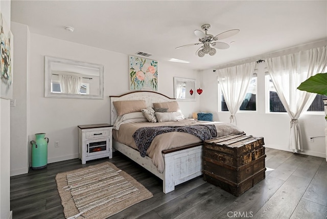 bedroom featuring dark hardwood / wood-style floors and ceiling fan