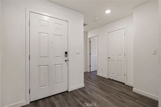 entrance foyer with dark hardwood / wood-style flooring