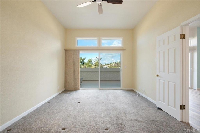 empty room featuring ceiling fan, carpet floors, and baseboards