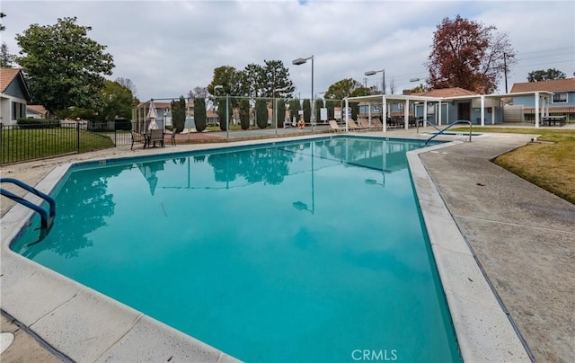 view of swimming pool with a patio