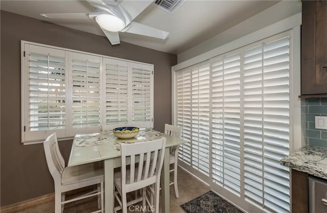 dining area with ceiling fan