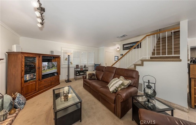 living room with ornamental molding and light carpet