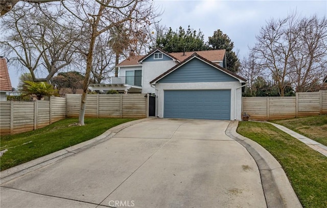 view of front of property with a garage and a front yard