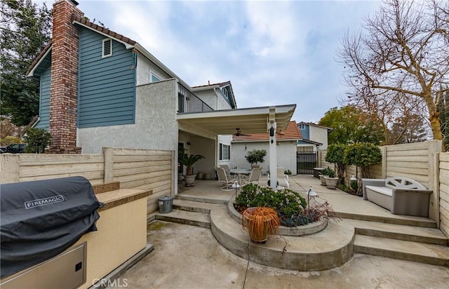 rear view of property with a patio area