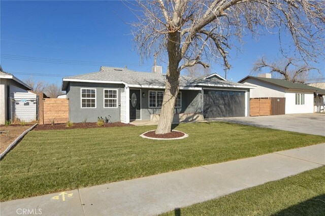 single story home with a garage and a front yard