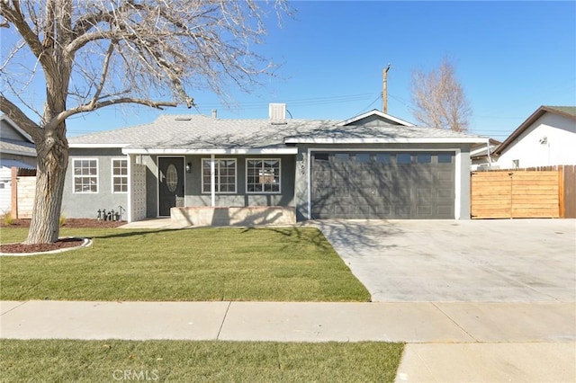 ranch-style house featuring a garage and a front lawn