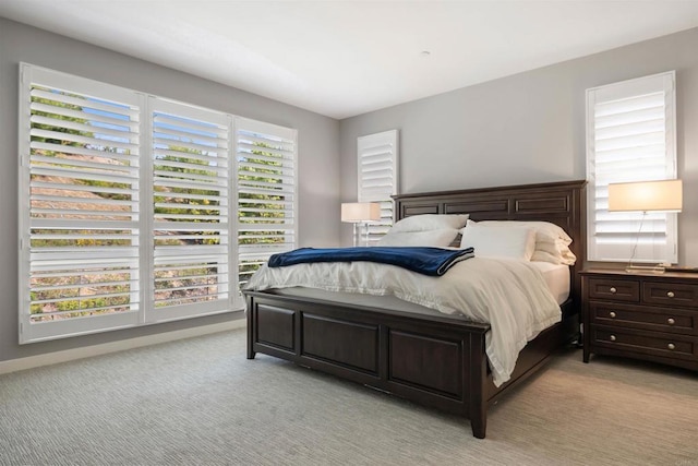 bedroom featuring light carpet