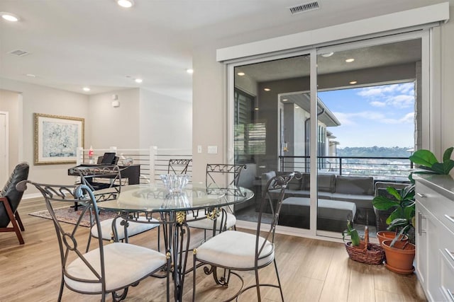 dining area with light hardwood / wood-style flooring