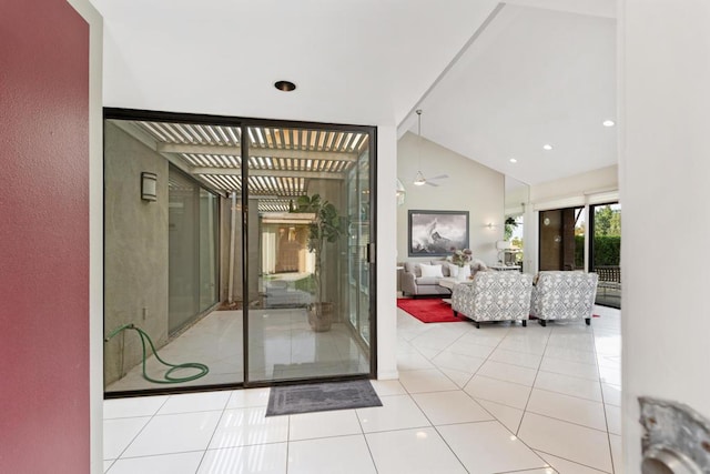 interior space with tile patterned flooring and lofted ceiling