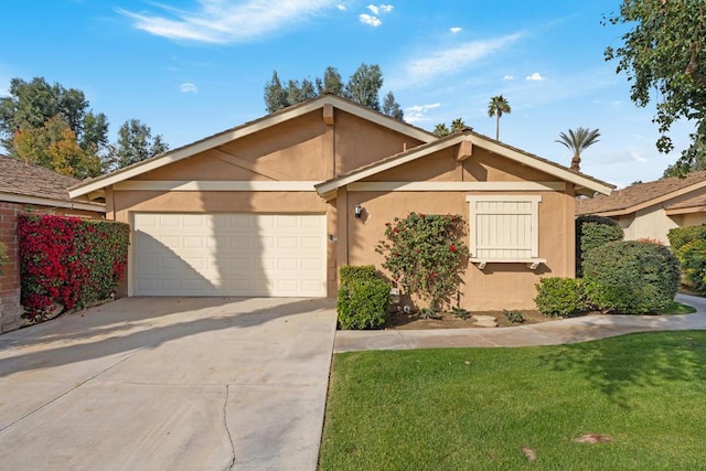 view of front of property with a garage and a front yard