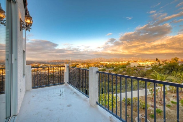 view of balcony at dusk