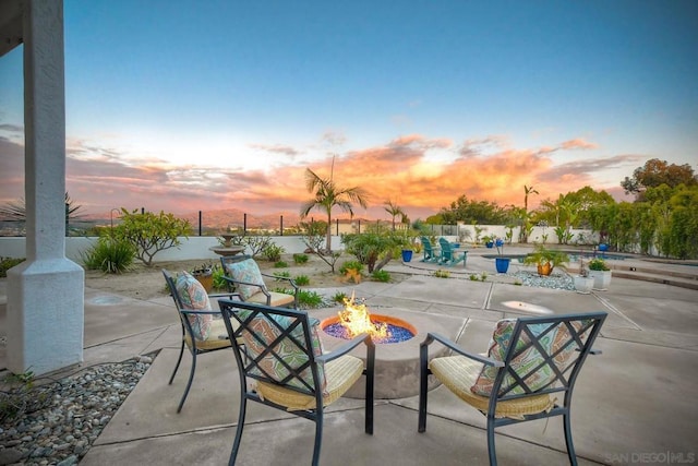 patio terrace at dusk with a fire pit