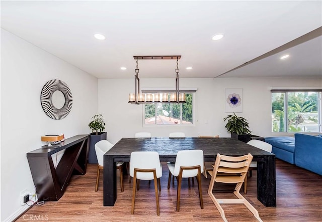 dining room with a notable chandelier and wood-type flooring