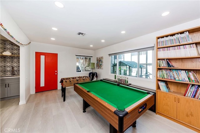 recreation room featuring pool table and light hardwood / wood-style flooring