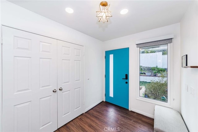 entryway with dark hardwood / wood-style floors