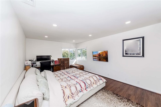 bedroom with wood-type flooring