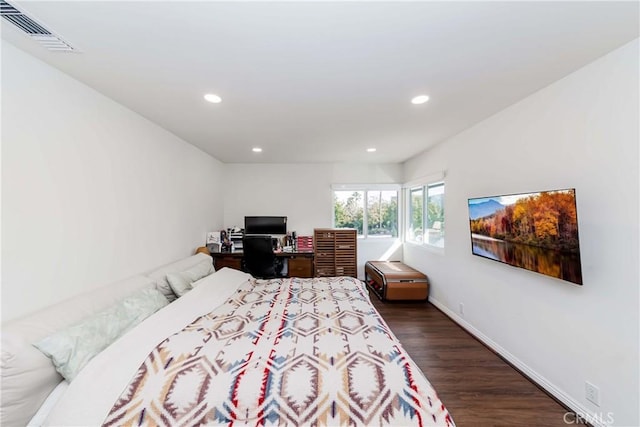 bedroom featuring dark wood-type flooring