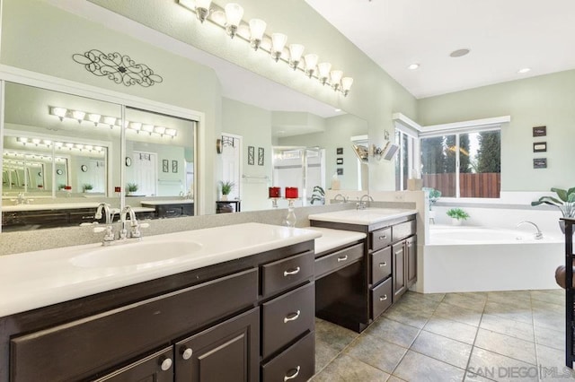 bathroom featuring vanity, separate shower and tub, and tile patterned flooring