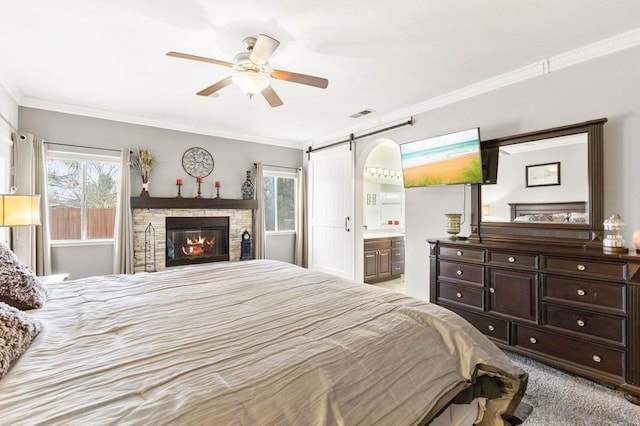 carpeted bedroom featuring crown molding, a barn door, and multiple windows