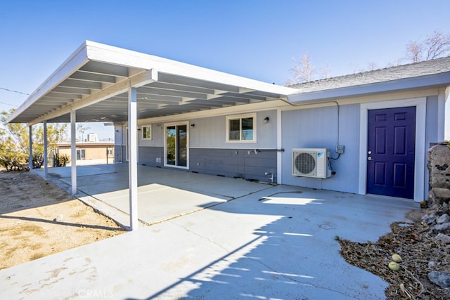 view of patio with a carport and ac unit