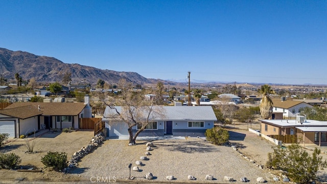 view of front of house featuring a mountain view and a garage