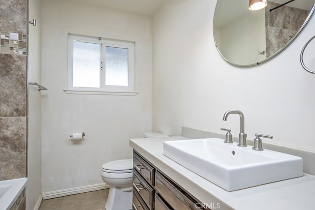 bathroom with tile patterned floors, vanity, and toilet