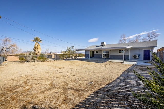 rear view of property with a patio area