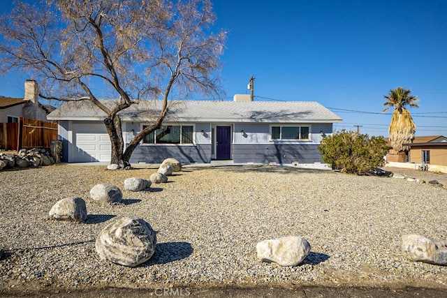 single story home with a garage