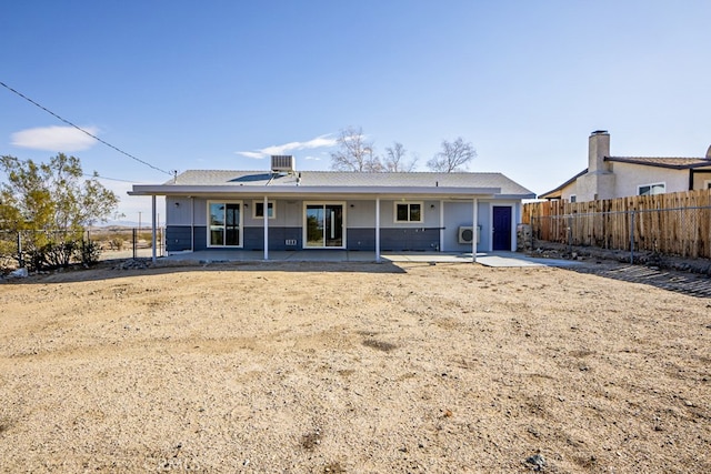 back of house with a patio