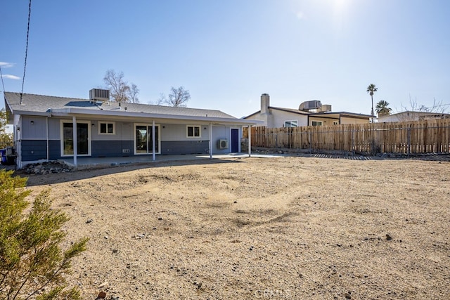 rear view of house featuring central AC and a patio