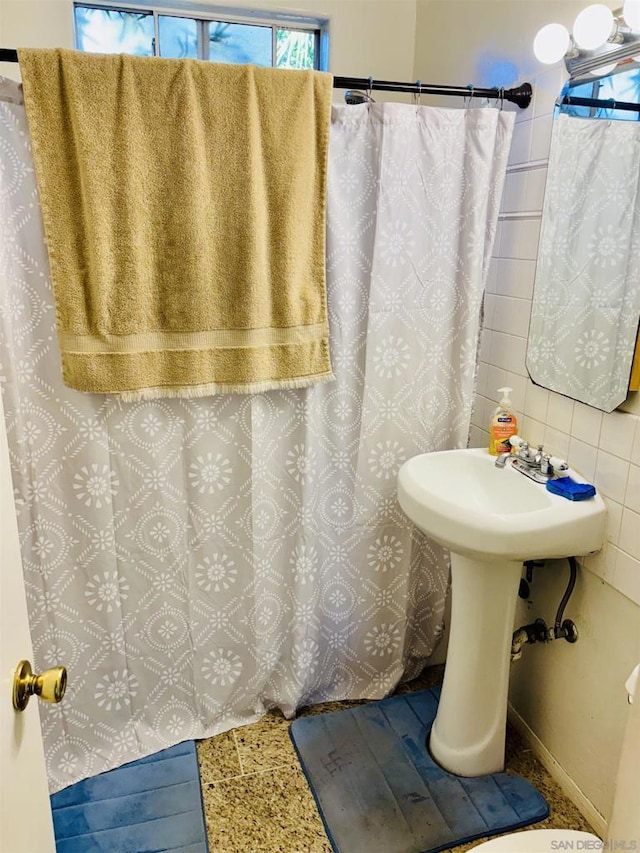 bathroom featuring decorative backsplash