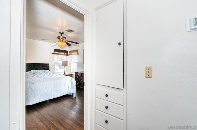 bedroom featuring dark hardwood / wood-style flooring and ceiling fan