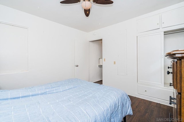 bedroom featuring dark hardwood / wood-style flooring and ceiling fan