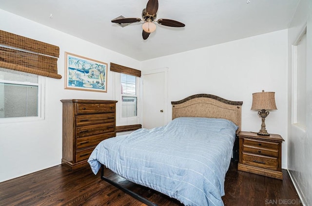 bedroom with dark wood-type flooring and ceiling fan