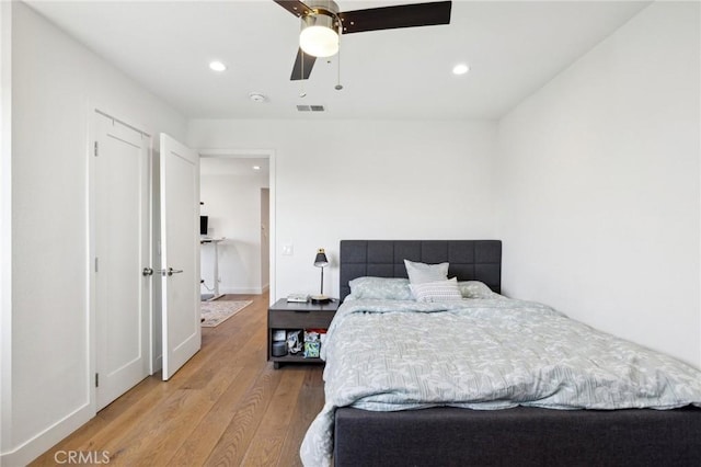 bedroom featuring ceiling fan and light hardwood / wood-style flooring