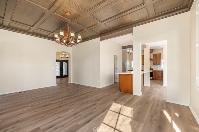 interior space with an inviting chandelier and wood-type flooring