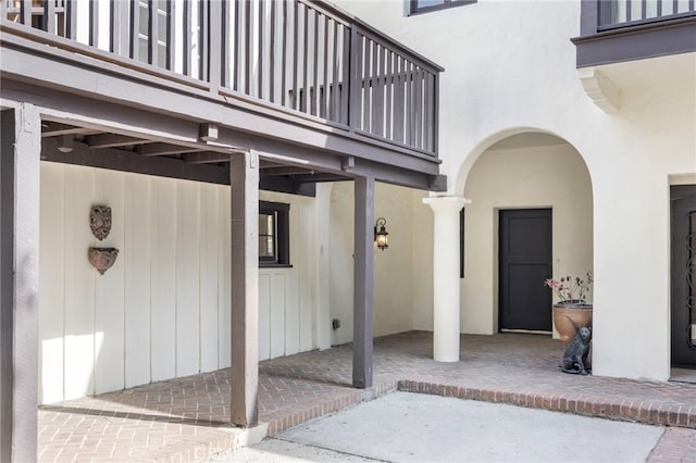 doorway to property featuring a patio area and a balcony