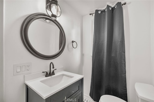 bathroom with vanity and toilet