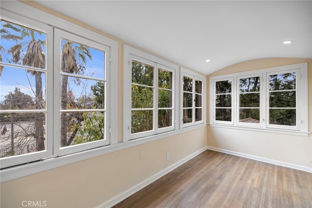 unfurnished sunroom with lofted ceiling