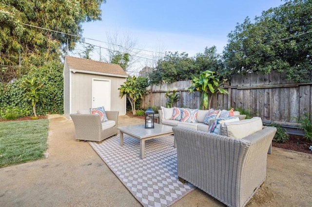 view of patio / terrace with an outdoor living space and a shed