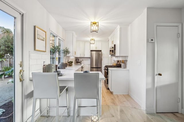 dining area with light wood-type flooring