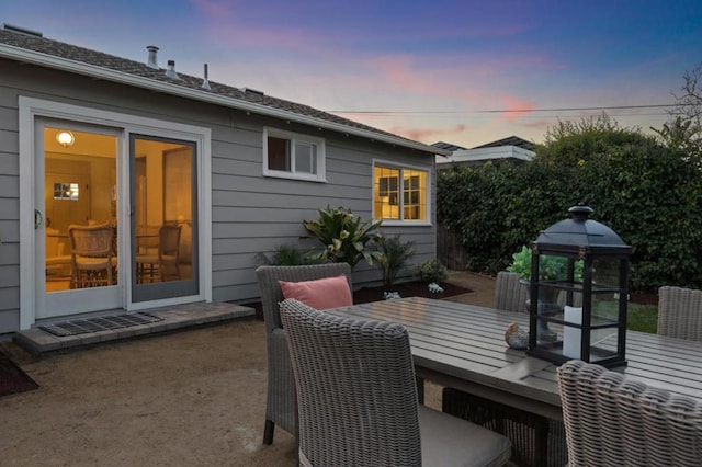 deck at dusk with a patio area