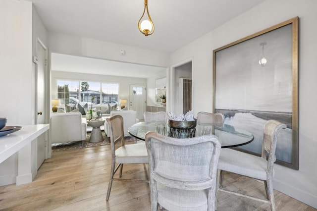 dining area with light wood-type flooring